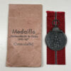 German Eastern Front Medal “Ostmedaille” w/ Original Packet – (Arbeitsgemeinschaft Metall & Kunststoff)